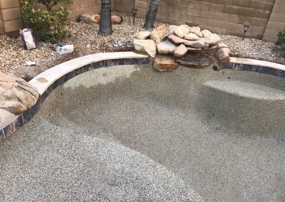 After new waterline tile and artistic pavers cap