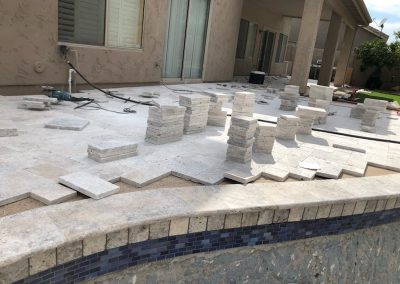 Mid custom travertine flat work and coping-cantilever with new tile and Pebble Sheen pool surfacing