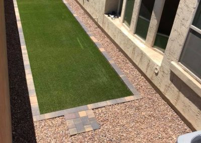 stone and artificial turf pathway